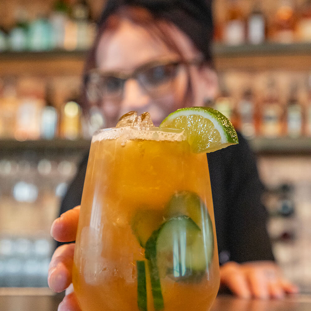 Fancy Cocktail Placed on the Bar by a Silos Bartender
